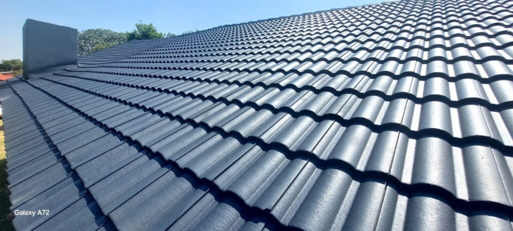 Tile roof finished in a charcoal coating